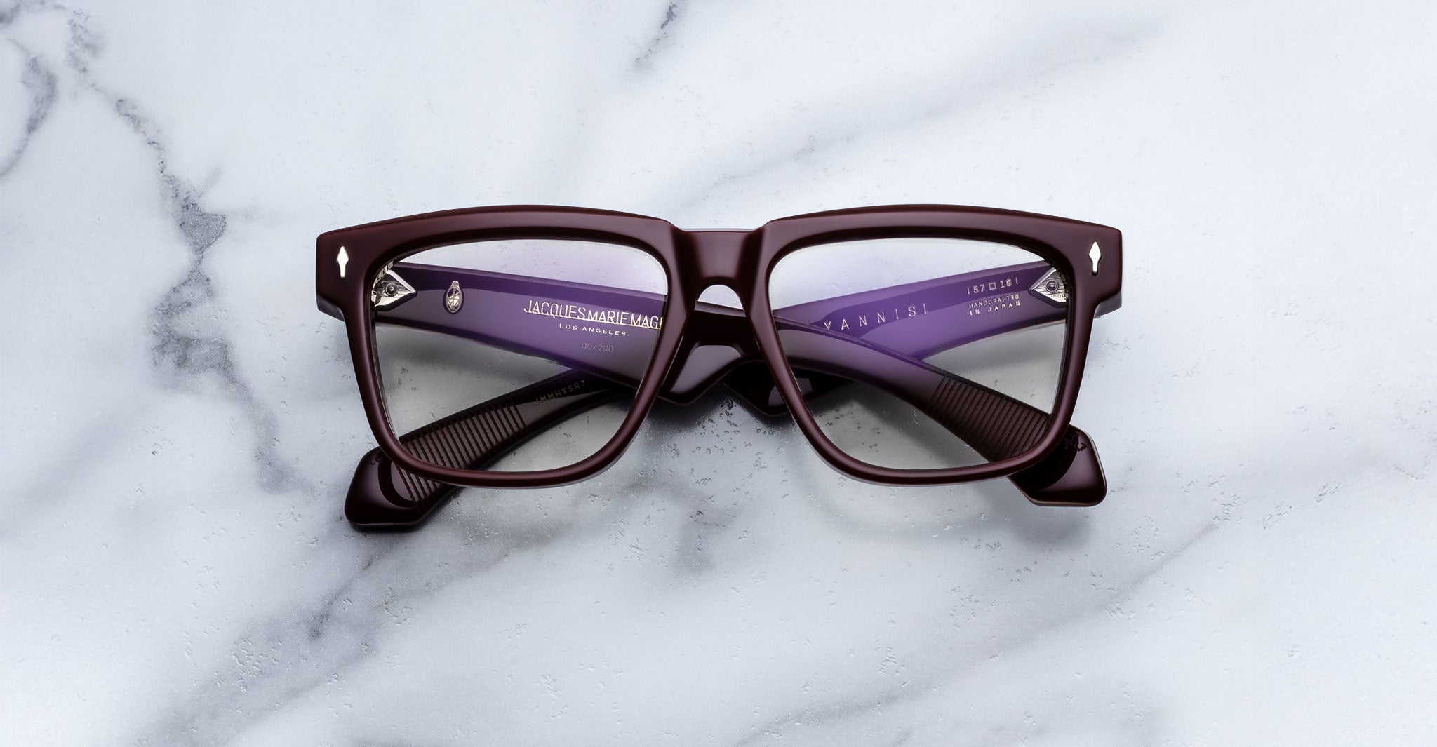 Jacques Marie Mage Hyannis in Bordeaux Empire eyeglasses, dark red rims with burgundy inner arms, viewed from above.
