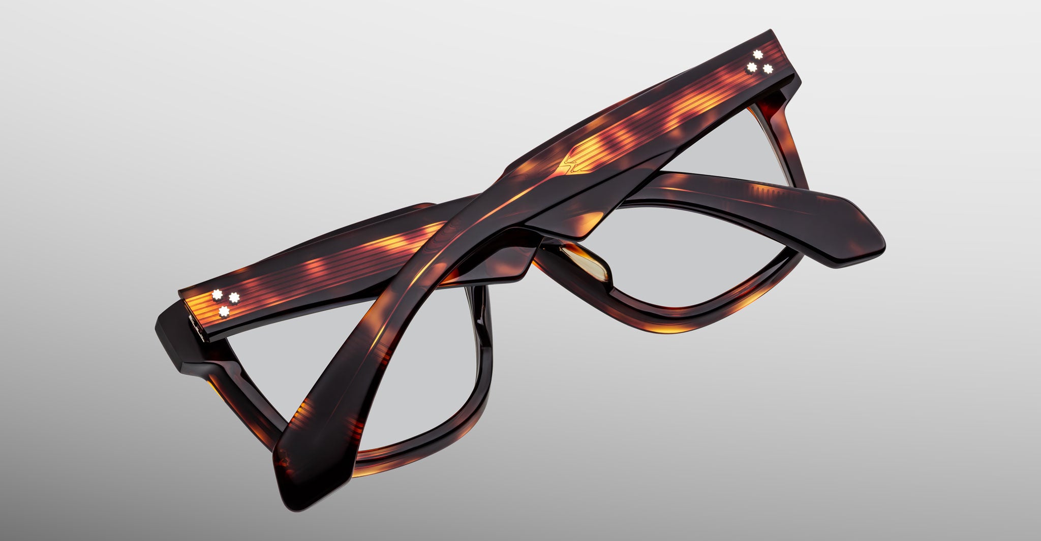 Jacques Marie Mage Hyannis in Tenace tortoiseshell acetate eyeglasses, thick frames, clear lenses, folded, shown from above.