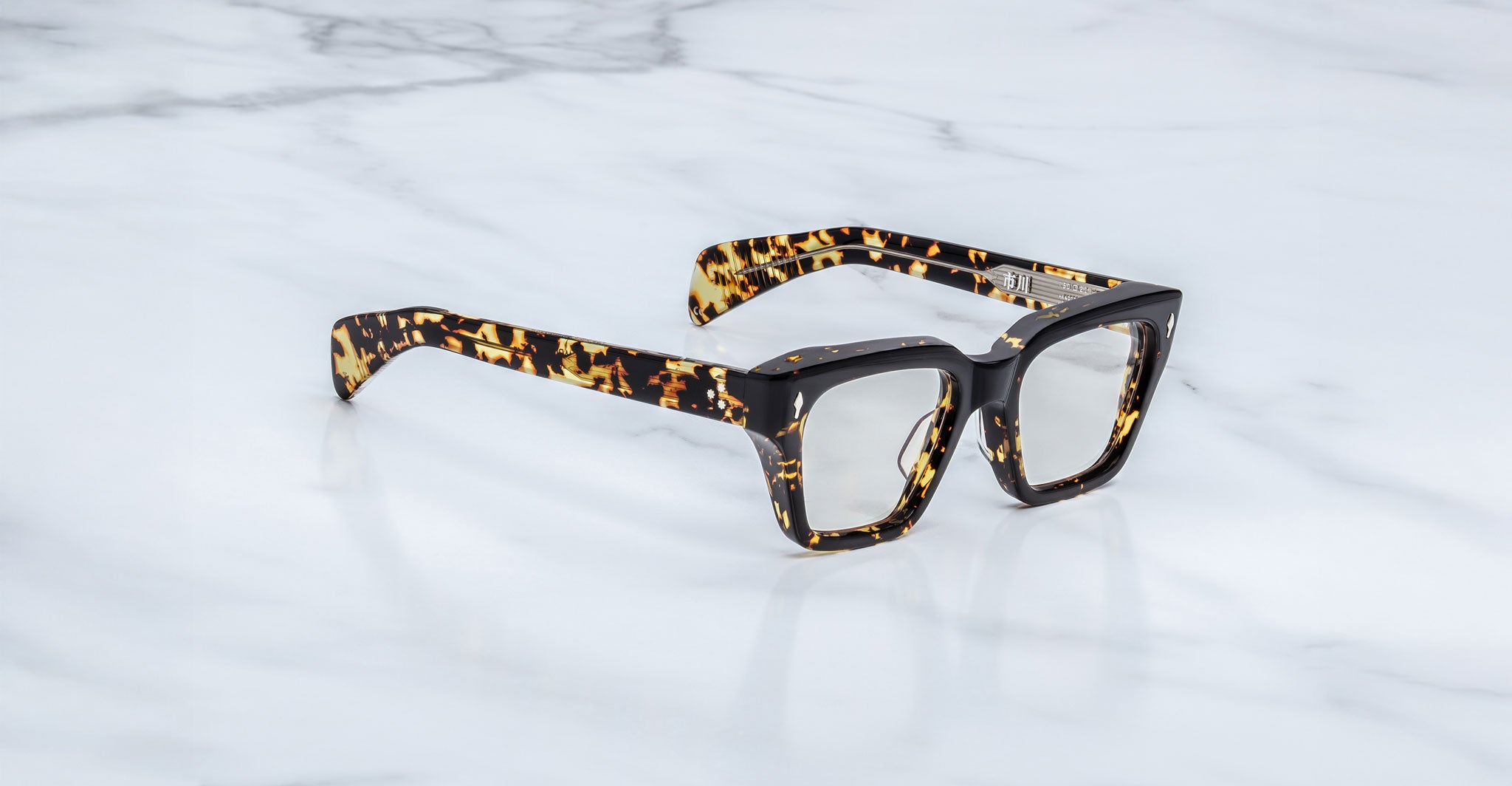 Jacques Marie Mage Ichikawa rectangular tortoiseshell eyeglasses with thick frames, front view.