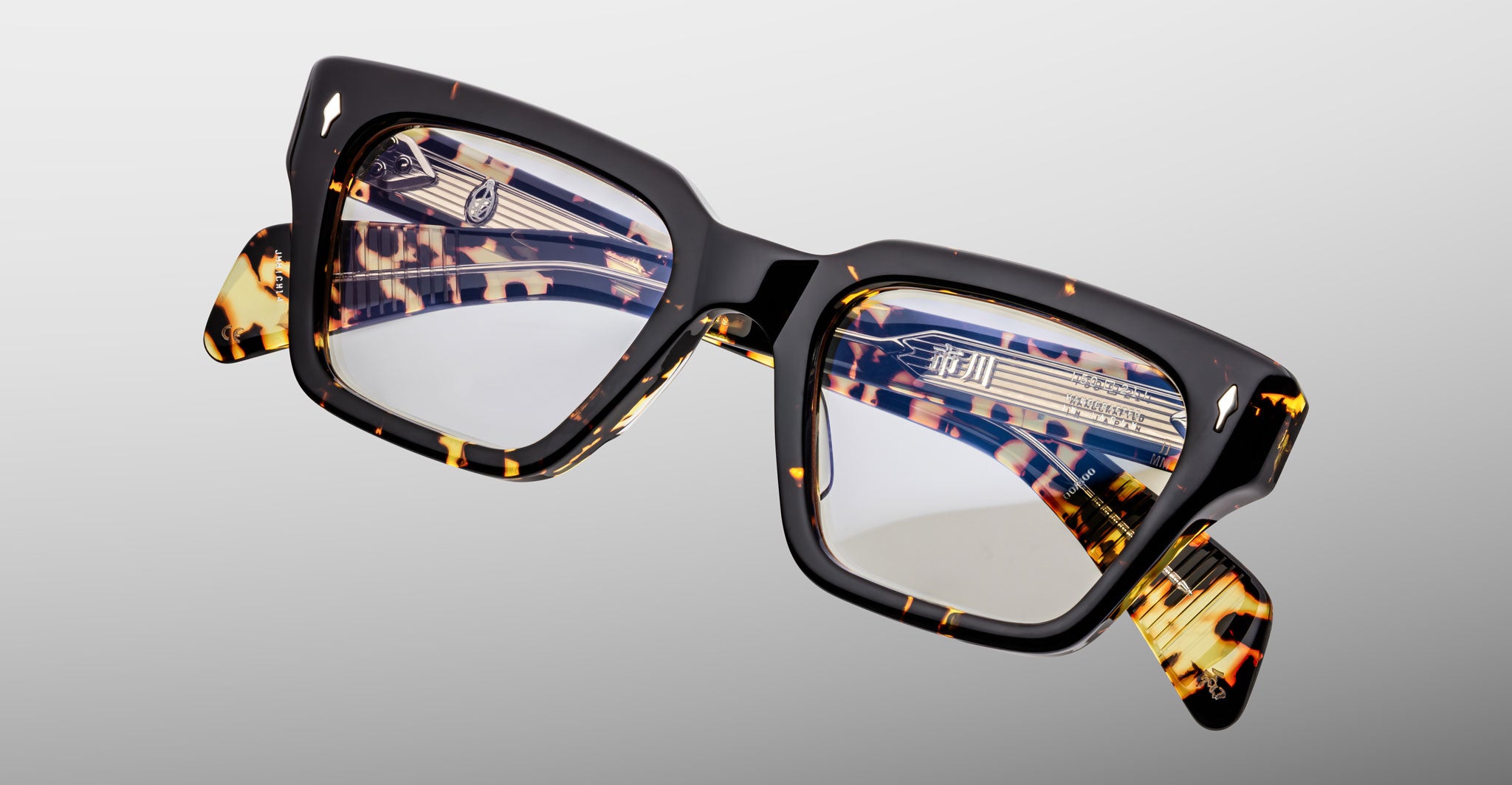 Jacques Marie Mage Ichikawa eyeglasses, rectangular tortoiseshell frame, clear lenses, front view.