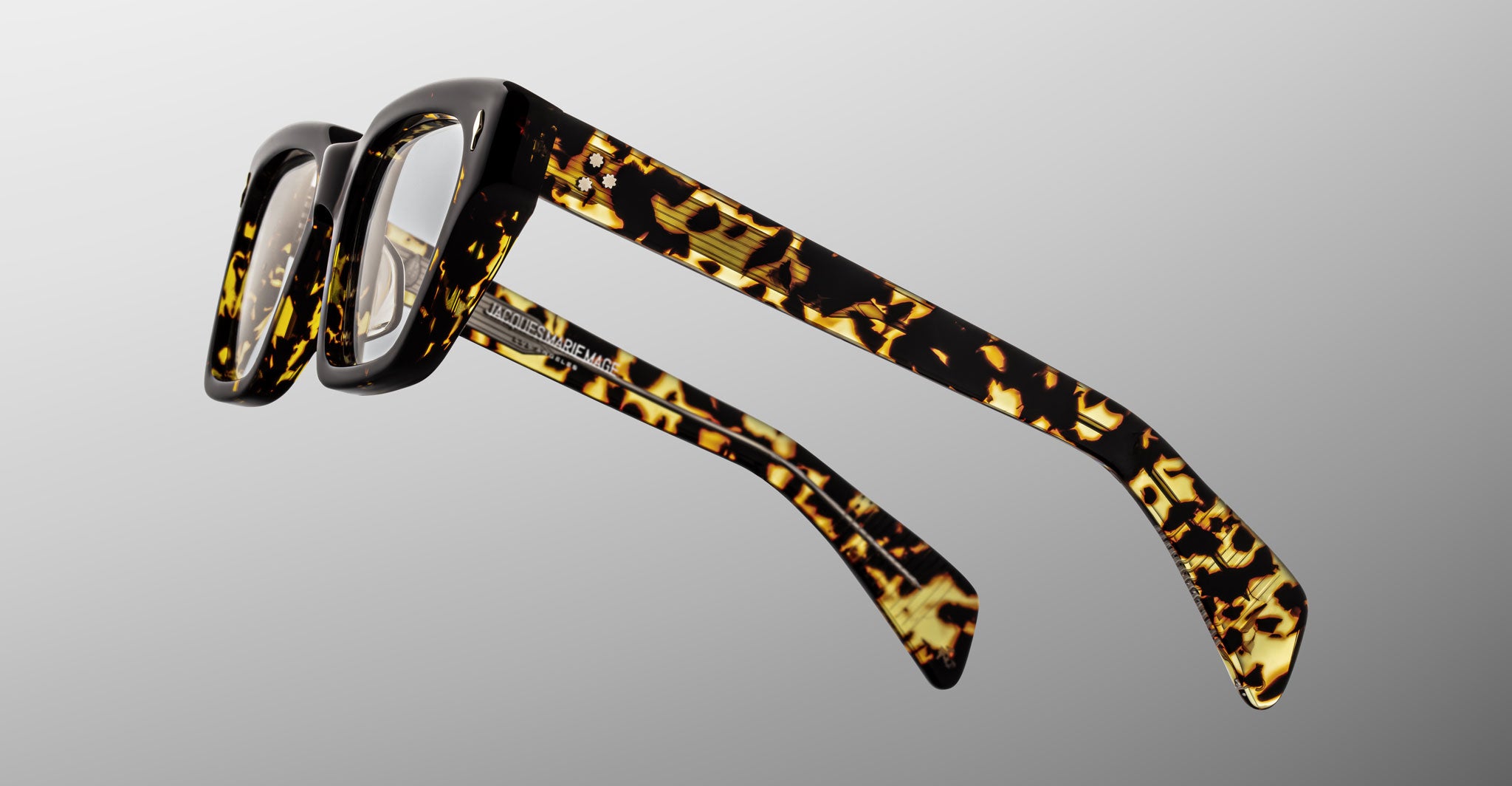 Jacques Marie Mage Ichikawa rectangular eyeglasses, tortoiseshell thick frames, silver hinges, shown from the front.