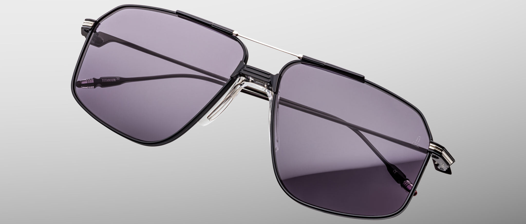 Jacques Marie Mage Jagger in Corbeau black metal sunglasses with dark tinted lenses, front view.
