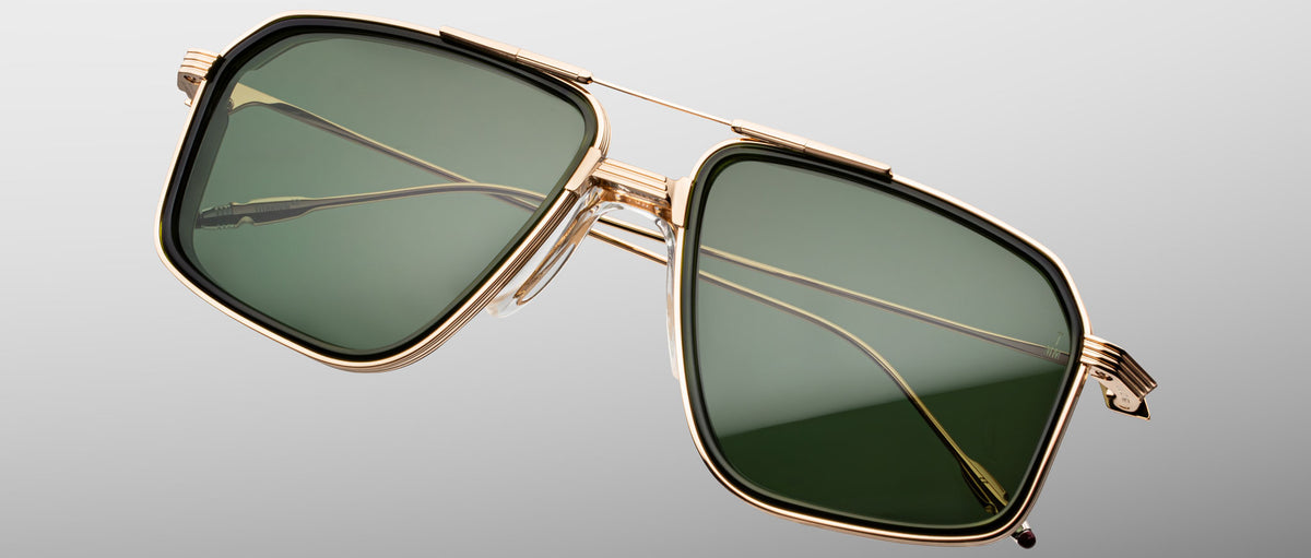 Jacques Marie Mage Jagger sunglasses with gold frames and green rectangular polarized lenses, front view.