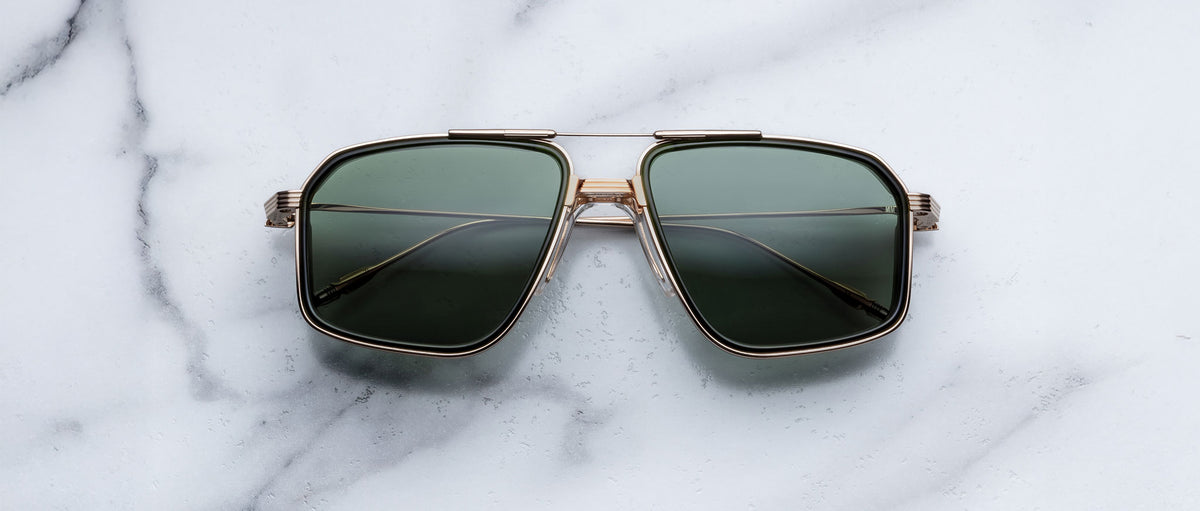 Jacques Marie Mage Jagger sunglasses, green aviator lenses with gold frames, front view.