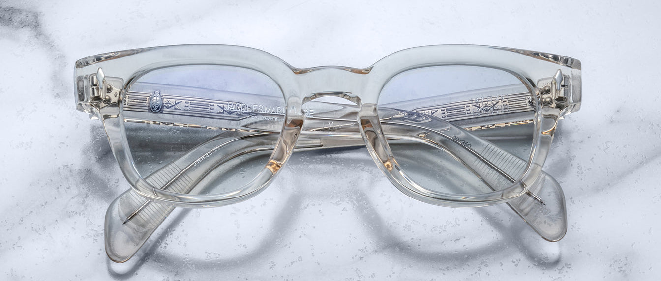 Jacques Marie Mage Julien in Beige rectangular optical frame in translucent beige acetate with a soft, neutral tone, featuring a keyhole bridge, signature arrowhead front pins, and exposed metal core detailing within the temples, shown with clear lenses.