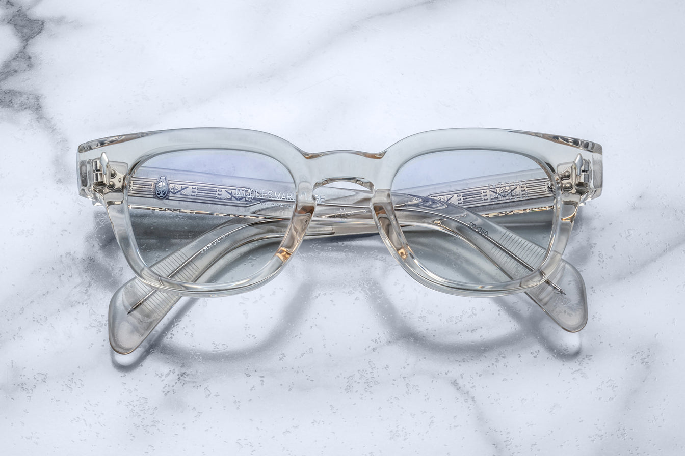 Jacques Marie Mage Julien in Beige rectangular optical frame in translucent beige acetate with a soft, neutral tone, featuring a keyhole bridge, signature arrowhead front pins, and exposed metal core detailing within the temples, shown with clear lenses.