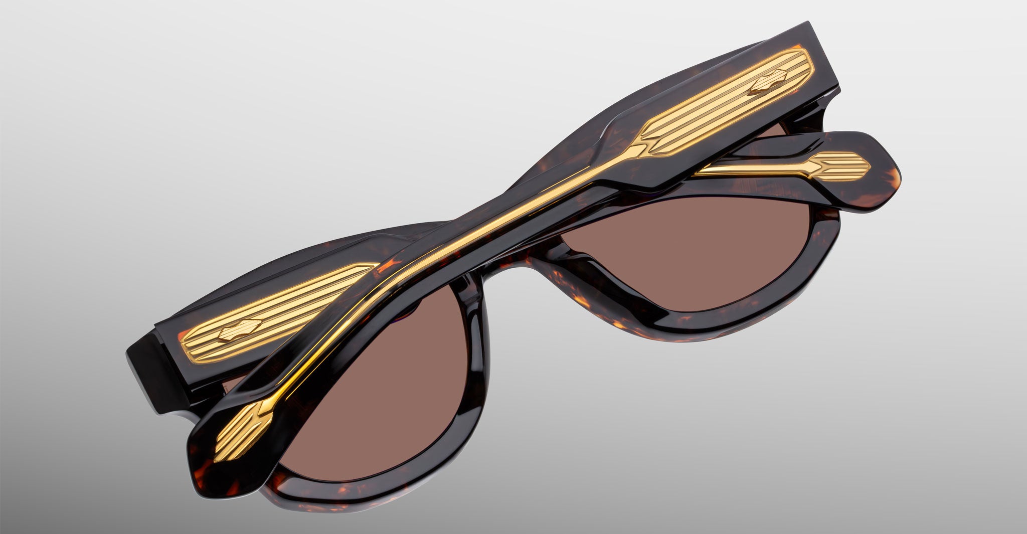 Jacques Marie Mage Kinshasa tortoiseshell sunglasses with gold-accented arms, side view.