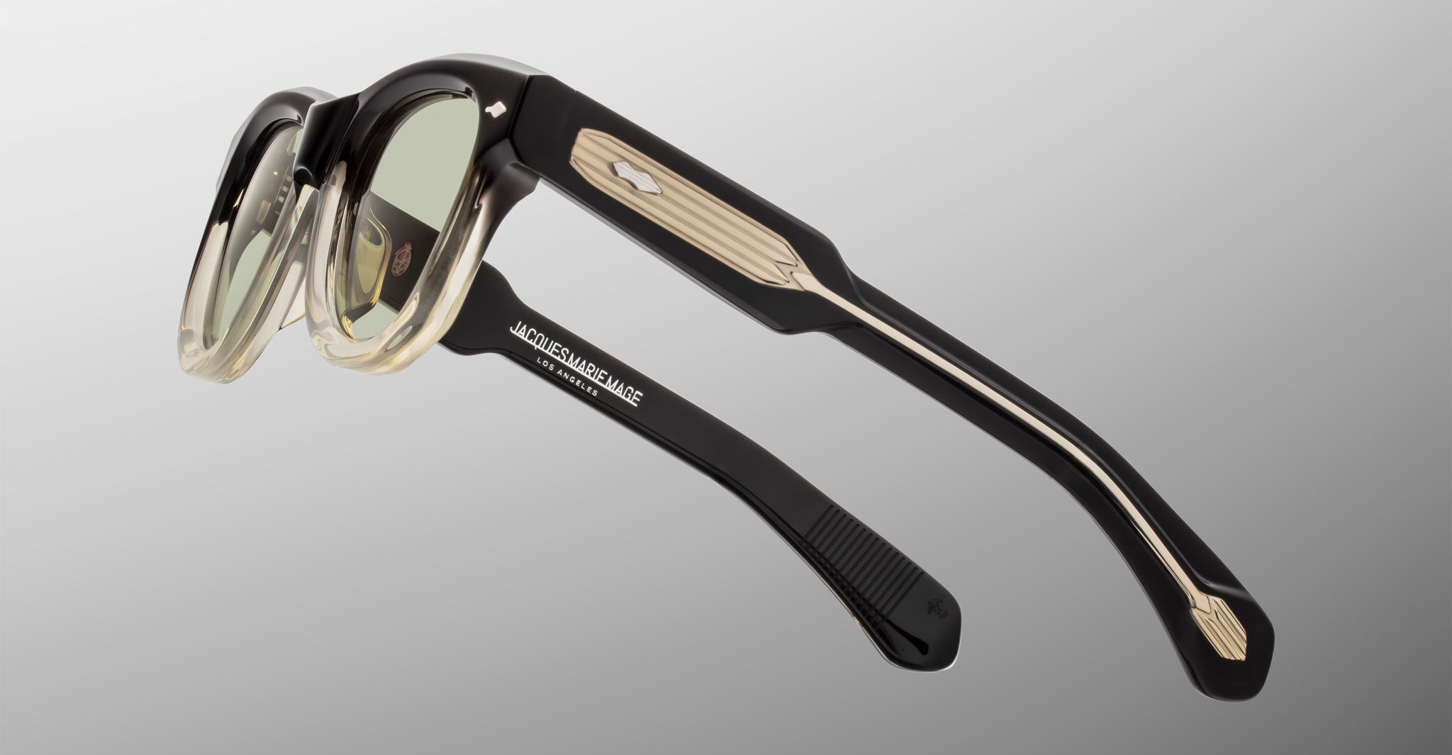 Jacques Marie Mage Kinshasa sunglasses, black and beige plastic with thick frames, rear view.