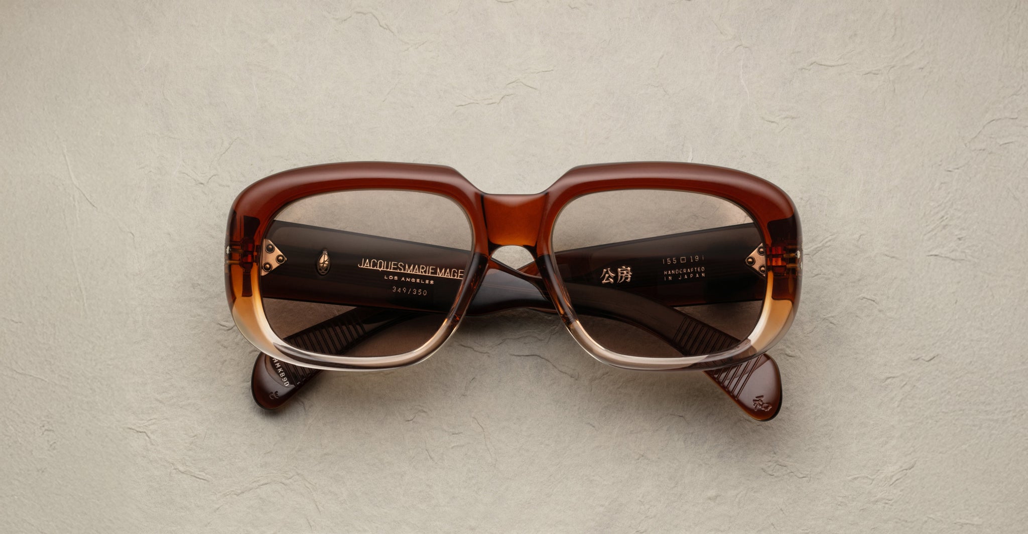 Jacques Marie Mage Kobo rectangular brown gradient eyeglasses with clear lenses, front view.