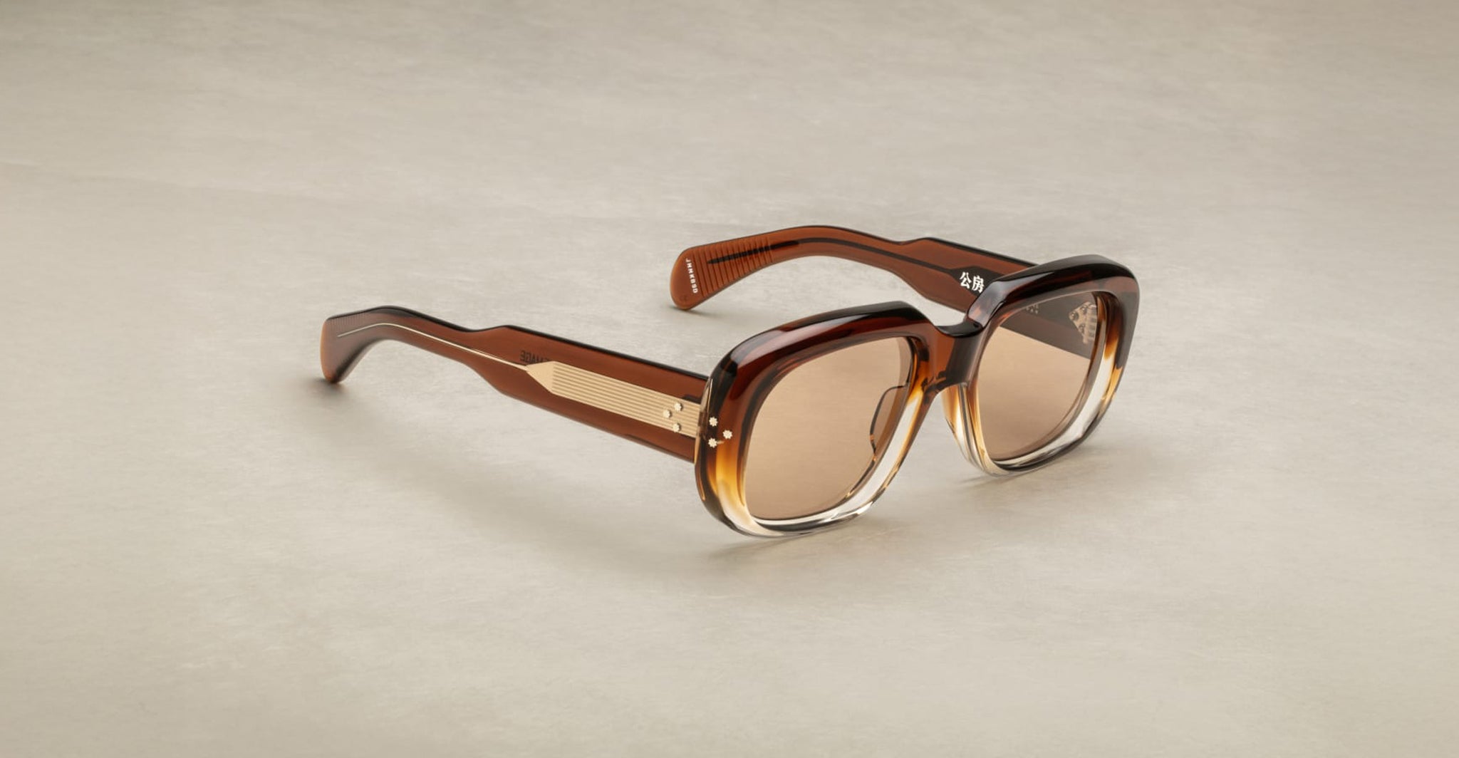 Jacques Marie Mage Kobo square sunglasses with thick brown gradient frames, gold accents, and UV protection, front view.