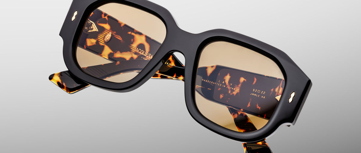 Jacques Marie Mage Lacy sunglasses, chunky square design with black frames, tortoiseshell arms, and UV light brown lenses.