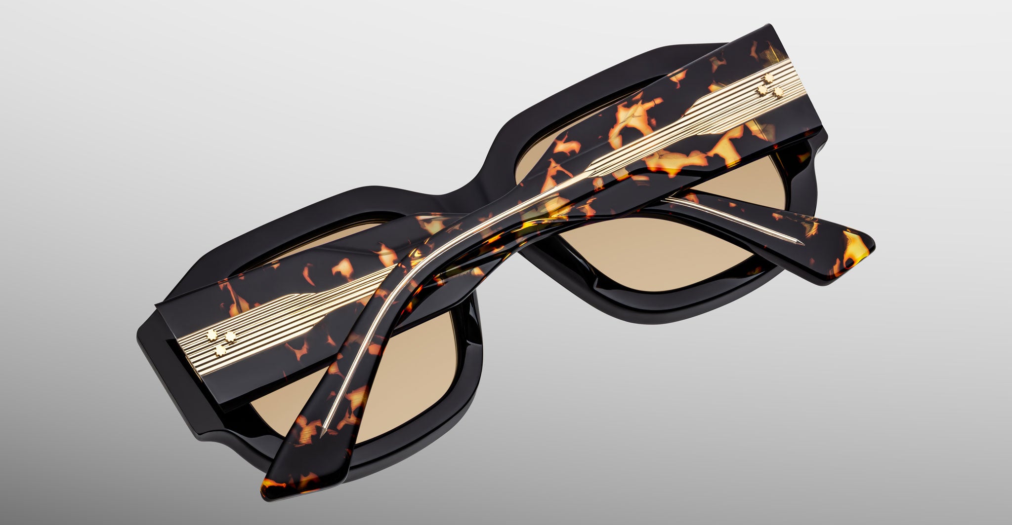 Jacques Marie Mage Lacy sunglasses with thick tortoiseshell frames, gold accents, and brown lenses, shown from the front angle.