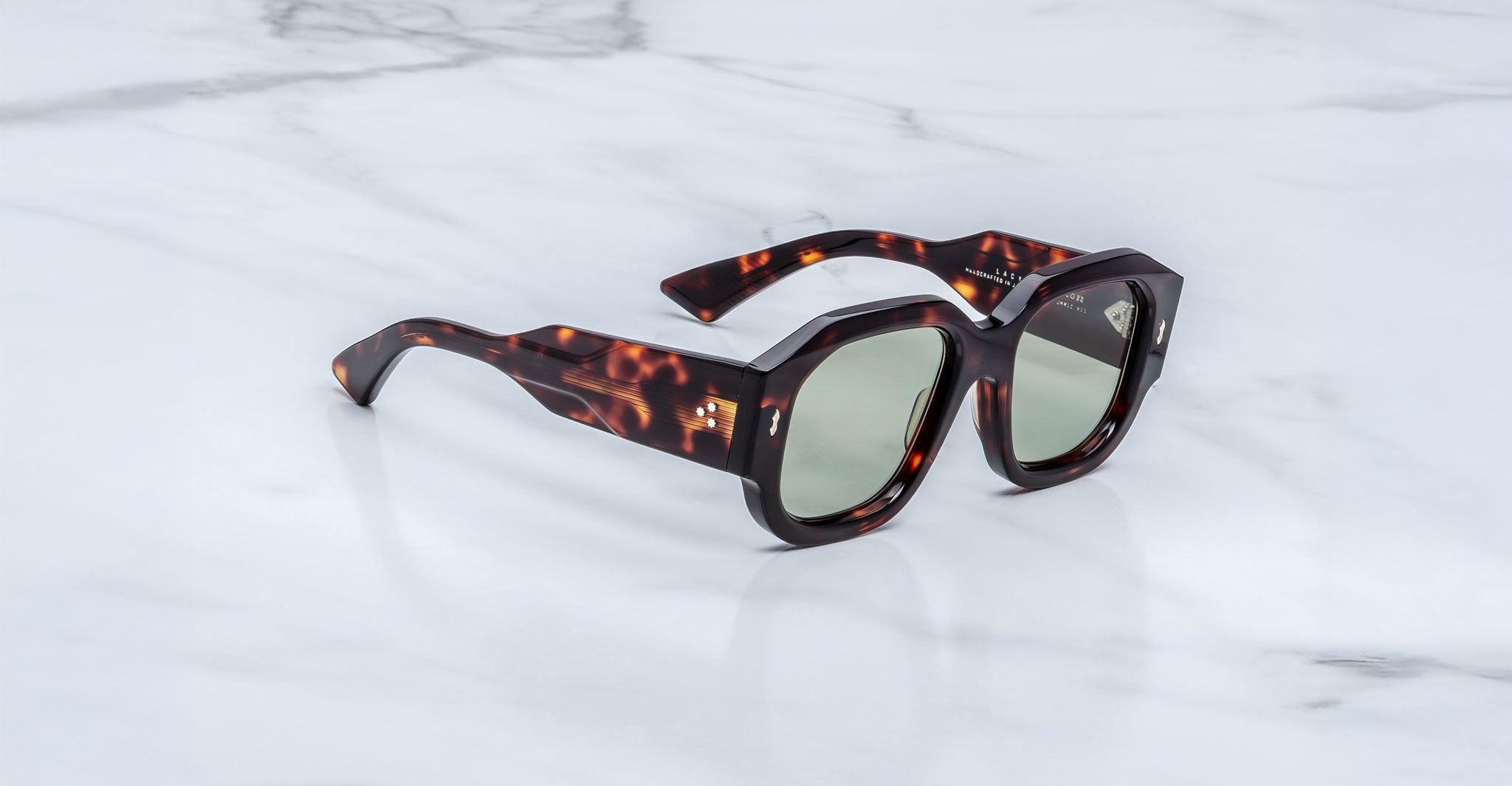 Jacques Marie Mage Lacy tortoiseshell square sunglasses with green lenses, top view.