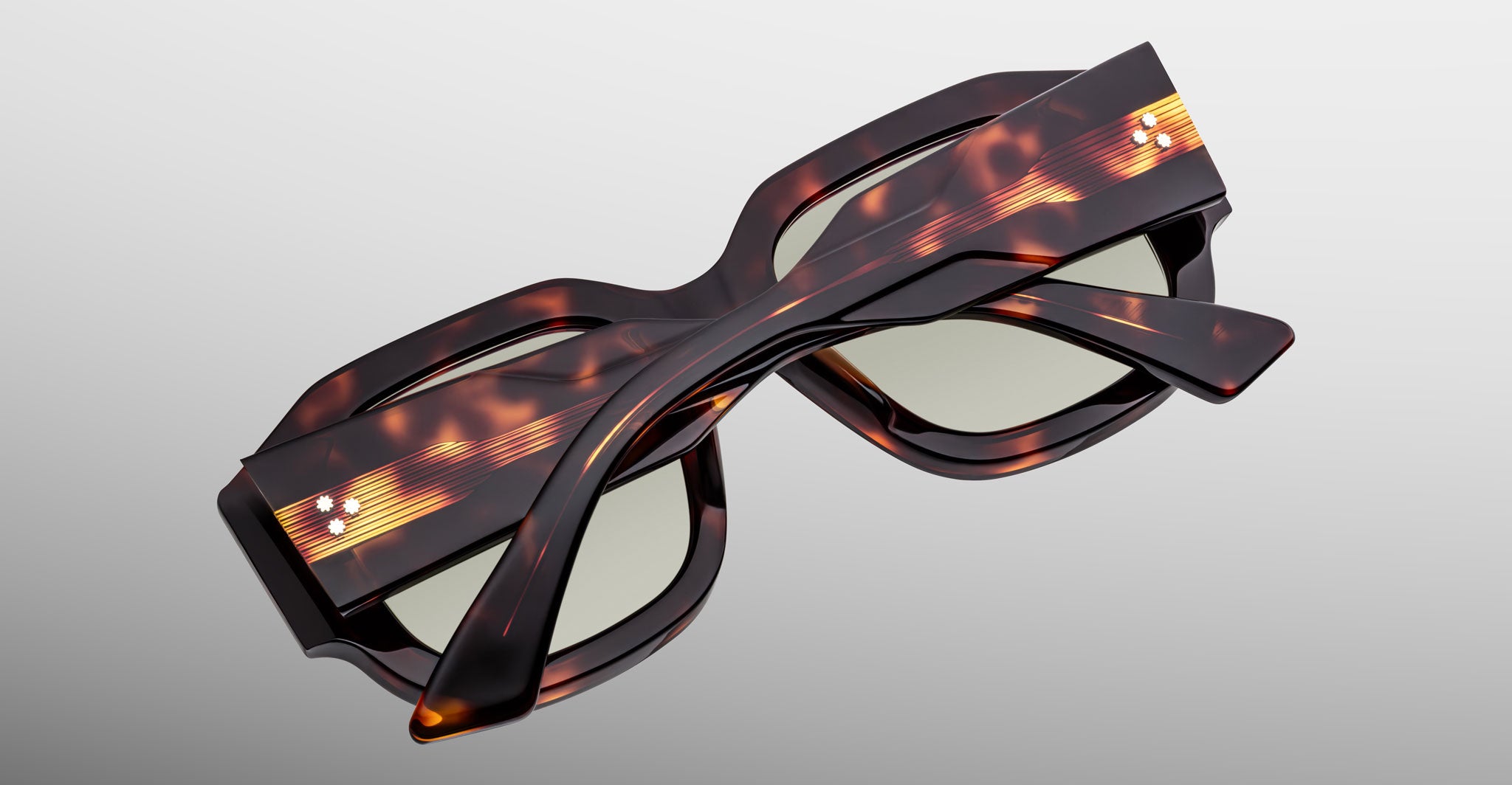 Jacques Marie Mage Lacy tortoiseshell polarized rectangular sunglasses, folded, viewed from above.