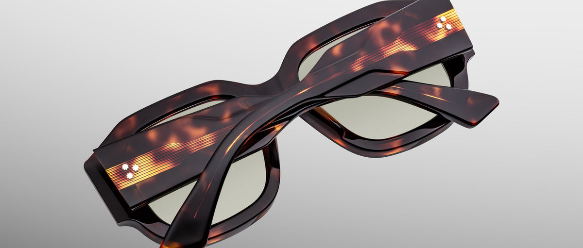 Jacques Marie Mage Lacy tortoiseshell polarized rectangular sunglasses, folded, viewed from above.