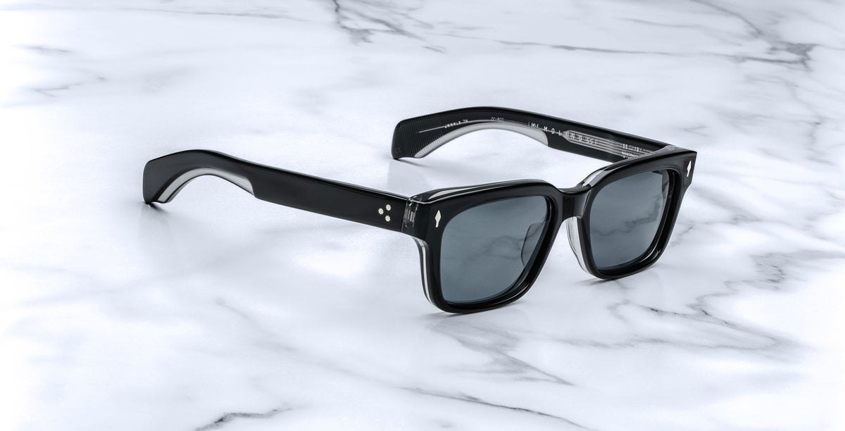 Jacques Marie Mage Molino 55 black rectangular sunglasses with dark lenses, top-down view.