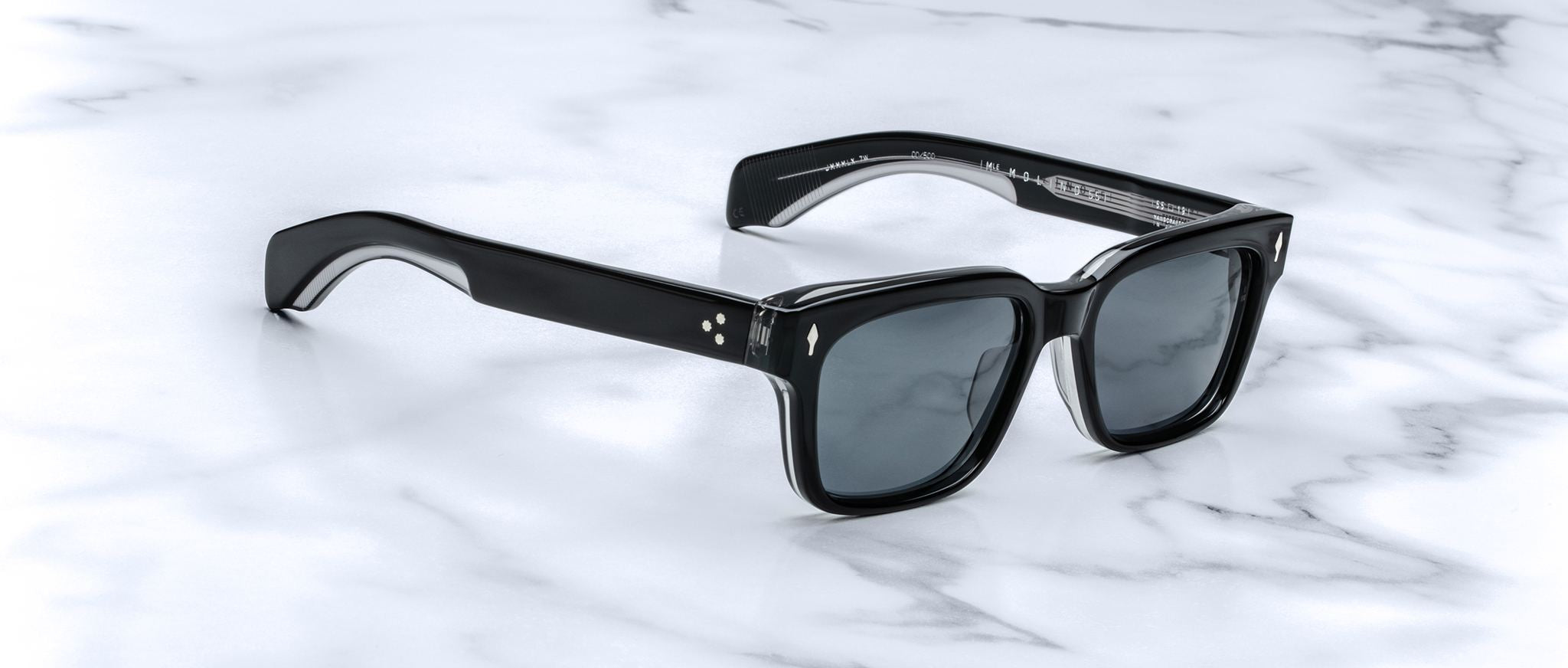 Jacques Marie Mage Molino 55 black rectangular sunglasses with dark lenses, top-down view.
