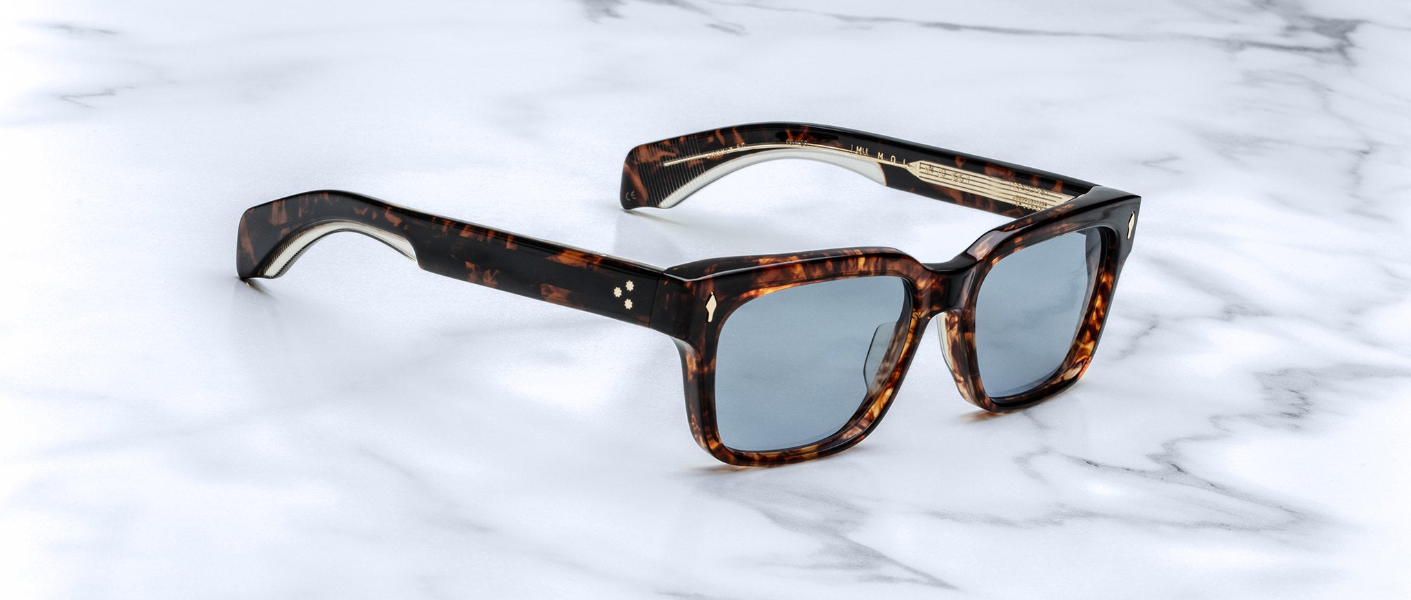 Jacques Marie Mage Molino 55 tortoiseshell sunglasses with blue lenses, top view.