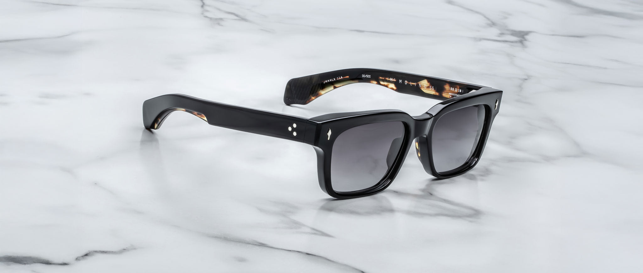 Jacques Marie Mage Molino 55 black rectangular sunglasses with dark lenses, top view.