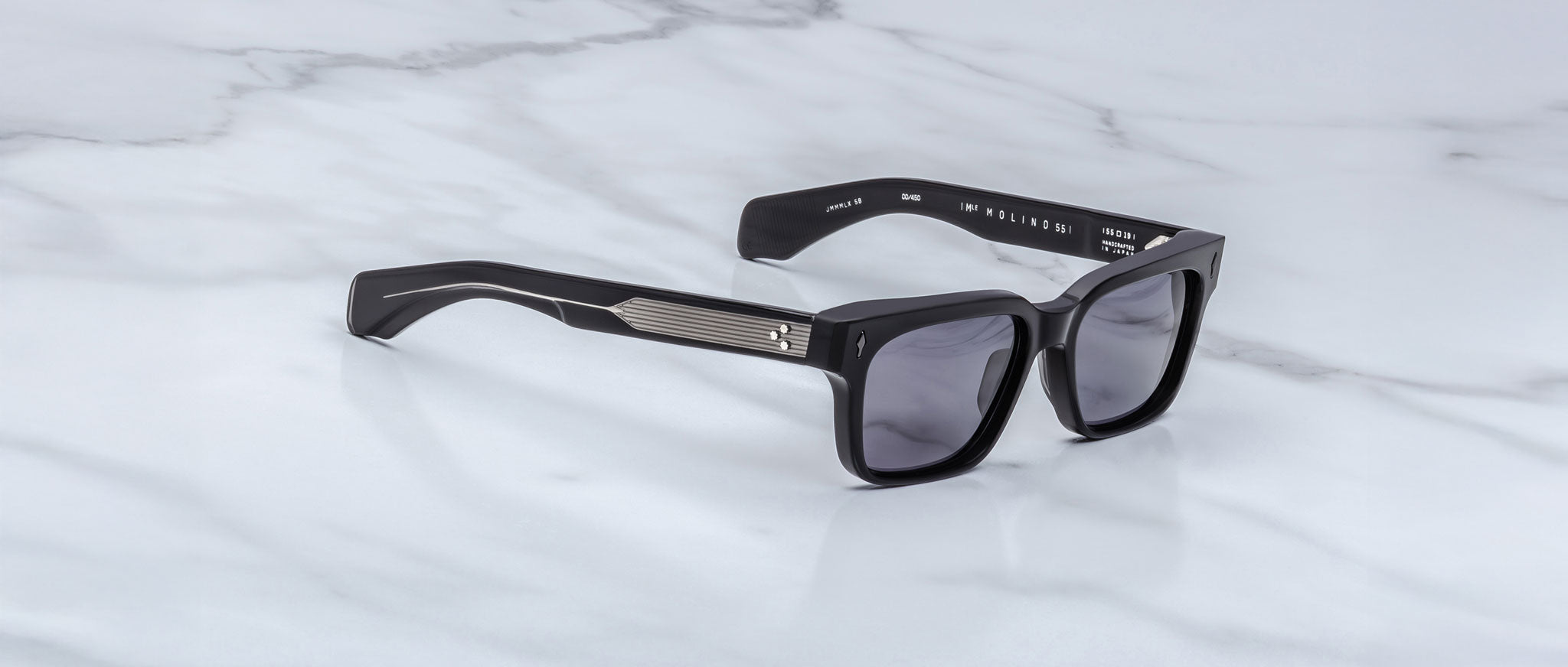 Jacques Marie Mage Molino 55 black rectangular sunglasses with dark lenses and metal temples, front angle view.