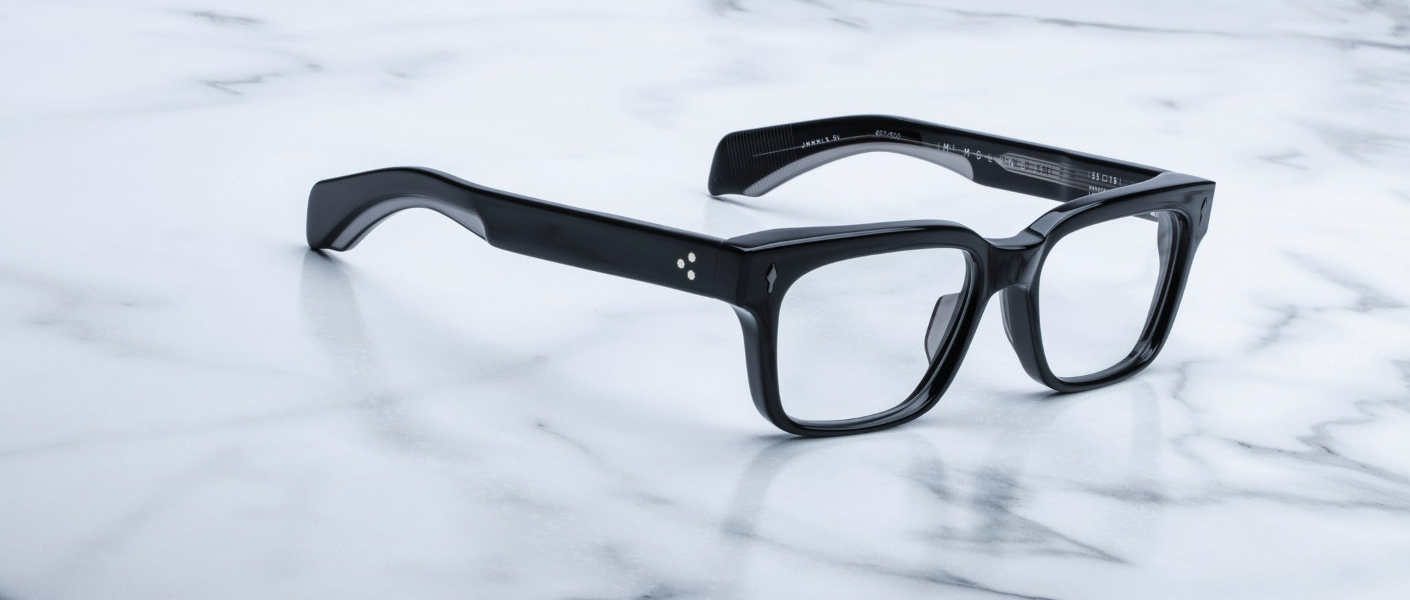 Jacques Marie Mage Molino 55 black rectangular eyeglasses with thick frames, top-down view.