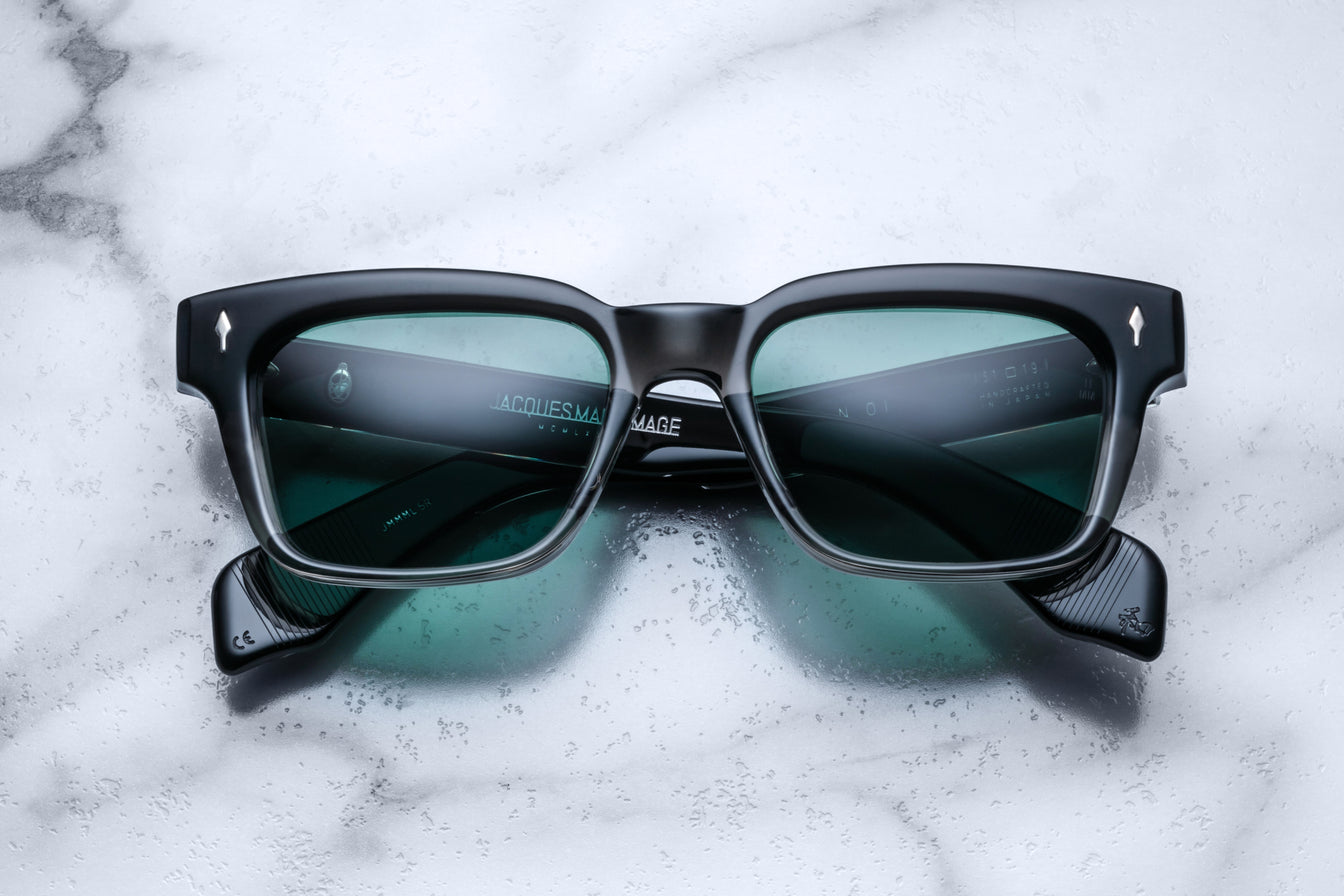 Jacques Marie Mage Walker black rectangular sunglasses with green lenses, top view.