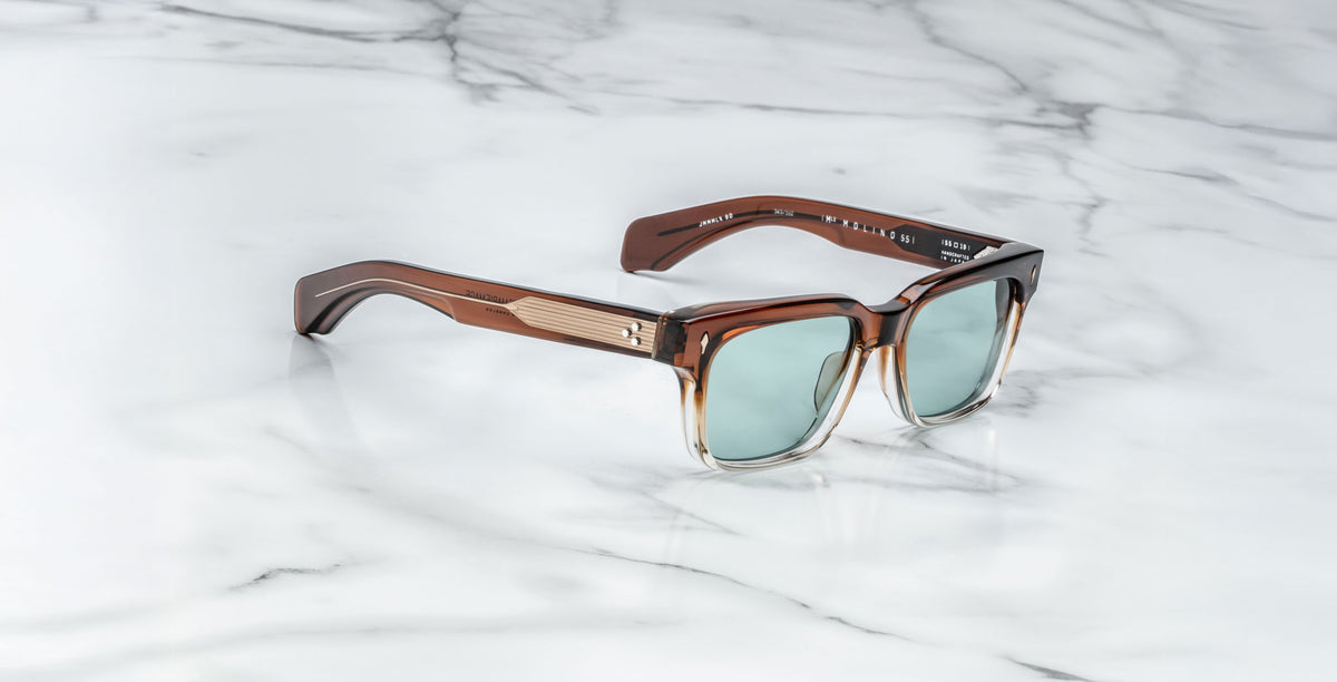 Jacques Marie Mage Molino square sunglasses with UV-protective light blue lenses, front view.