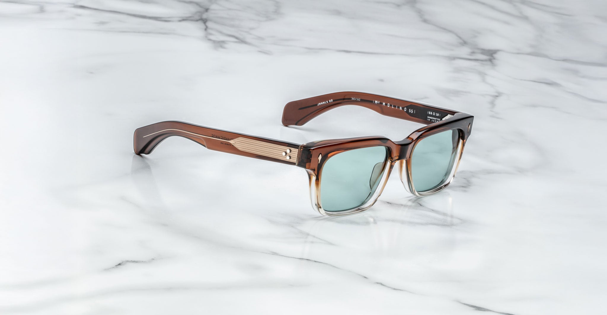 Jacques Marie Mage Molino square sunglasses with UV-protective light blue lenses, front view.