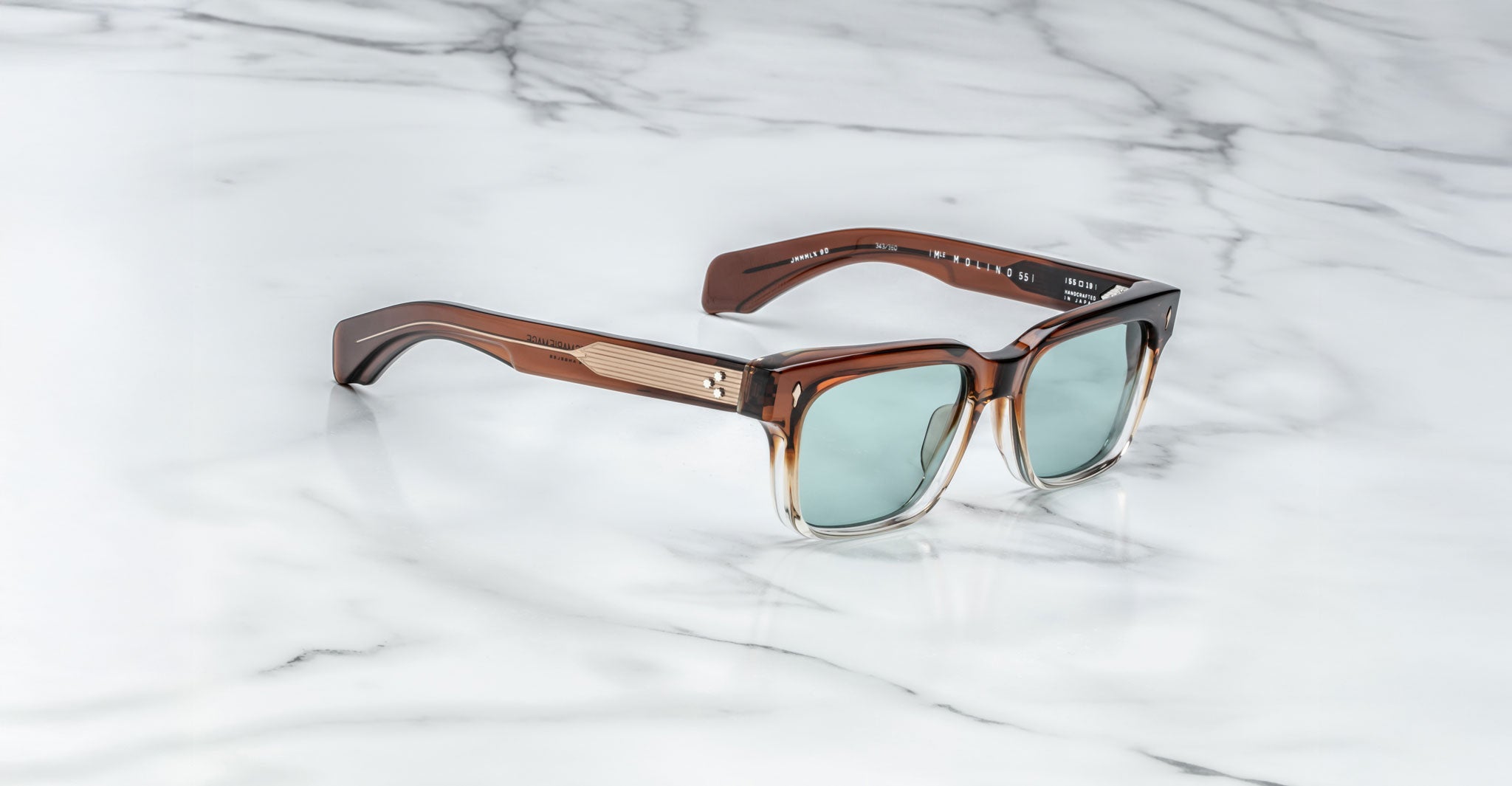 Jacques Marie Mage Molino square sunglasses with UV-protective light blue lenses, front view.