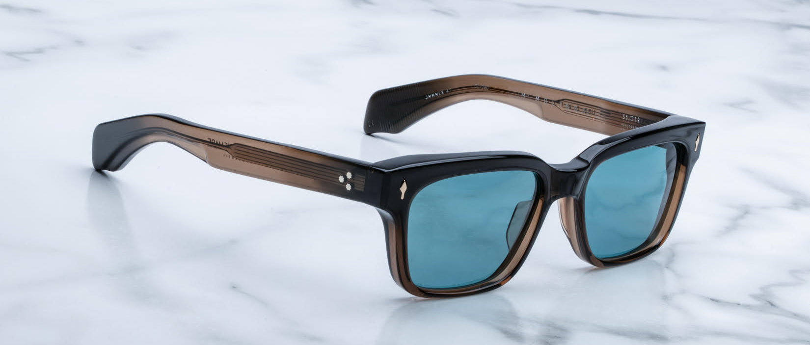 Jacques Marie Mage Molino 55 rectangular sunglasses with blue lenses and thick black-brown frames, front view.