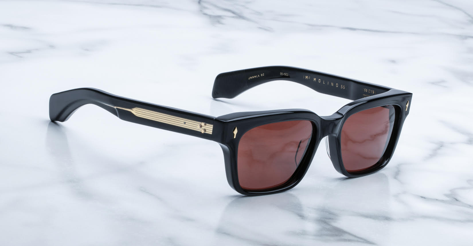 Jacques Marie Mage Molino 55 sunglasses, front view, brown polarized lenses with gold arm details.
