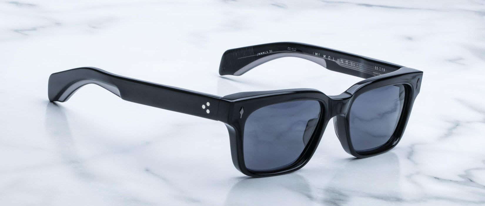 Jacques Marie Mage Molino 55 black rectangular sunglasses with dark lenses, top view.