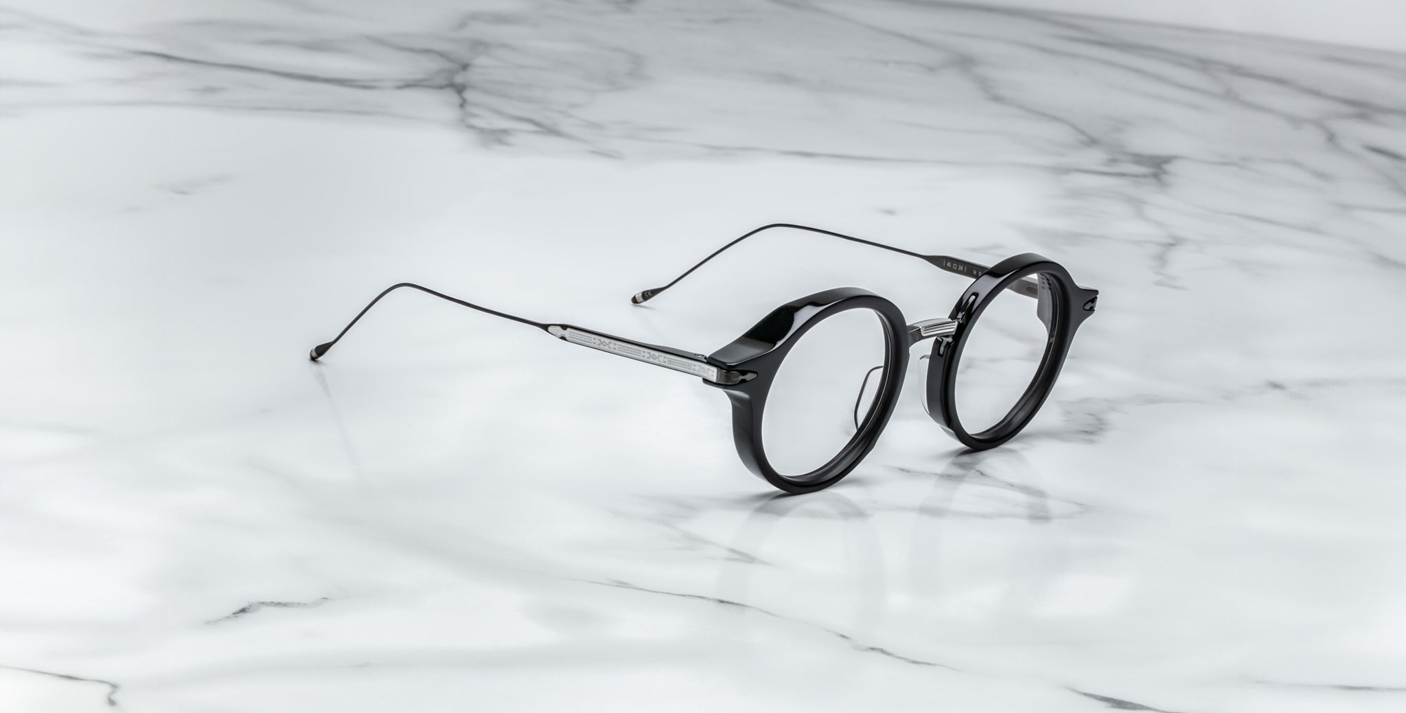 Jacques Marie Mage Norman eyeglasses, round metal frames, front view, display the brand’s classic design.