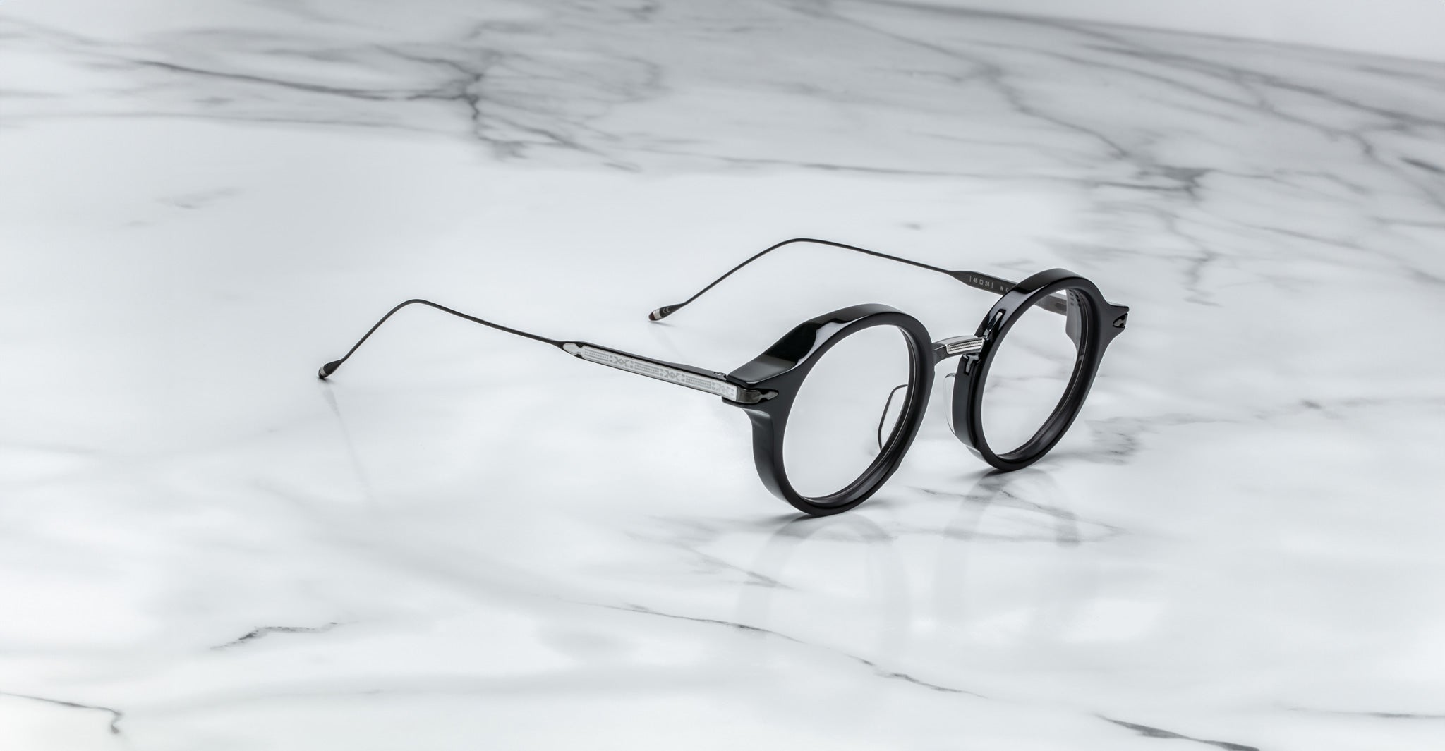 Jacques Marie Mage Norman eyeglasses, round metal frames, front view, display the brand’s classic design.