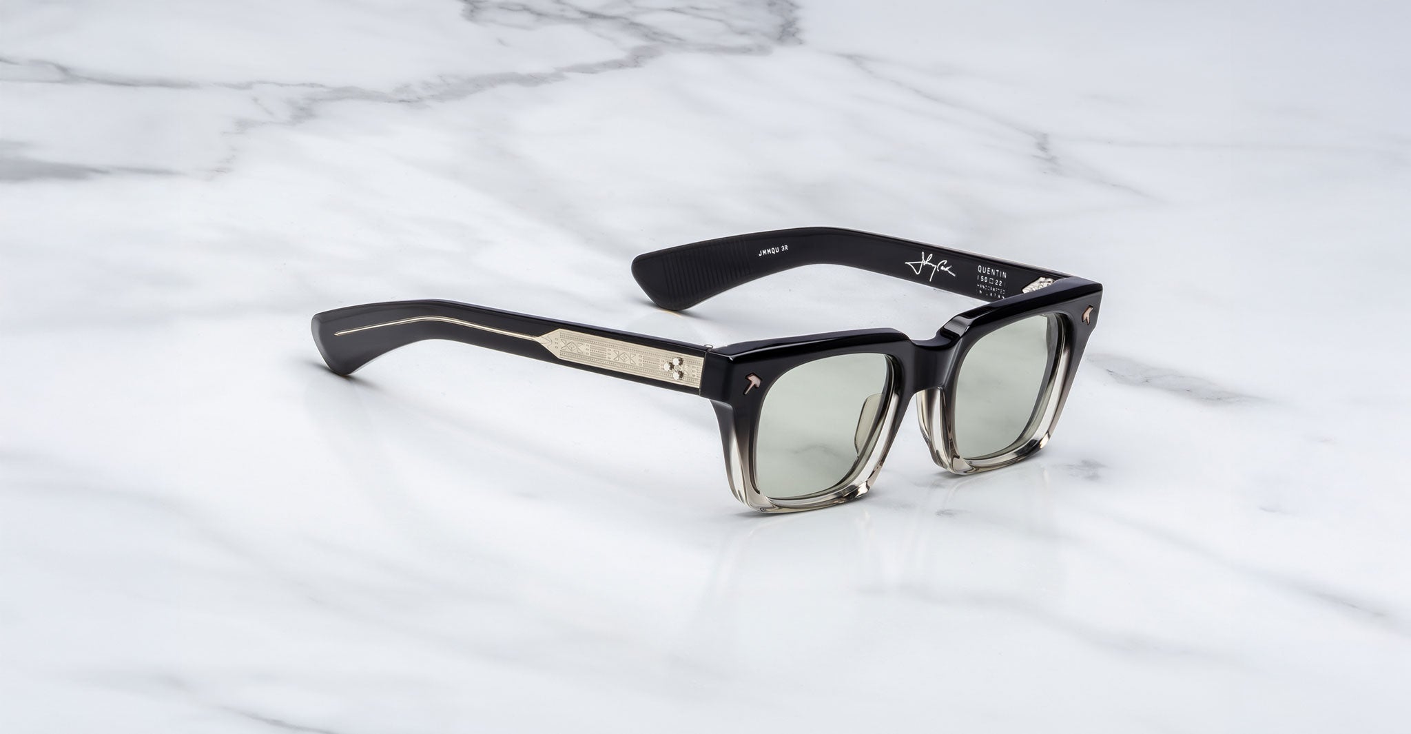Jacques Marie Mage Quentin sunglasses in black and gray with gold temples, front view, designer eyewear.