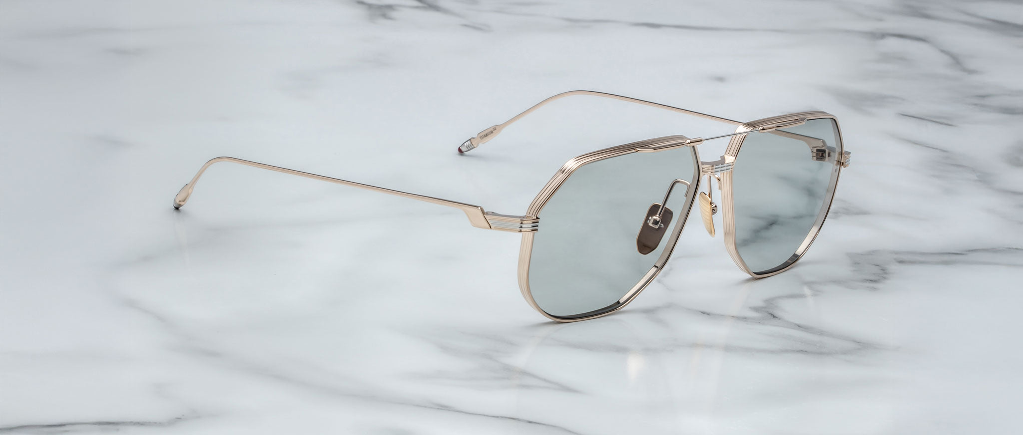 Jacques Marie Mage Reynold aviator sunglasses with tinted UV lenses, viewed from above.