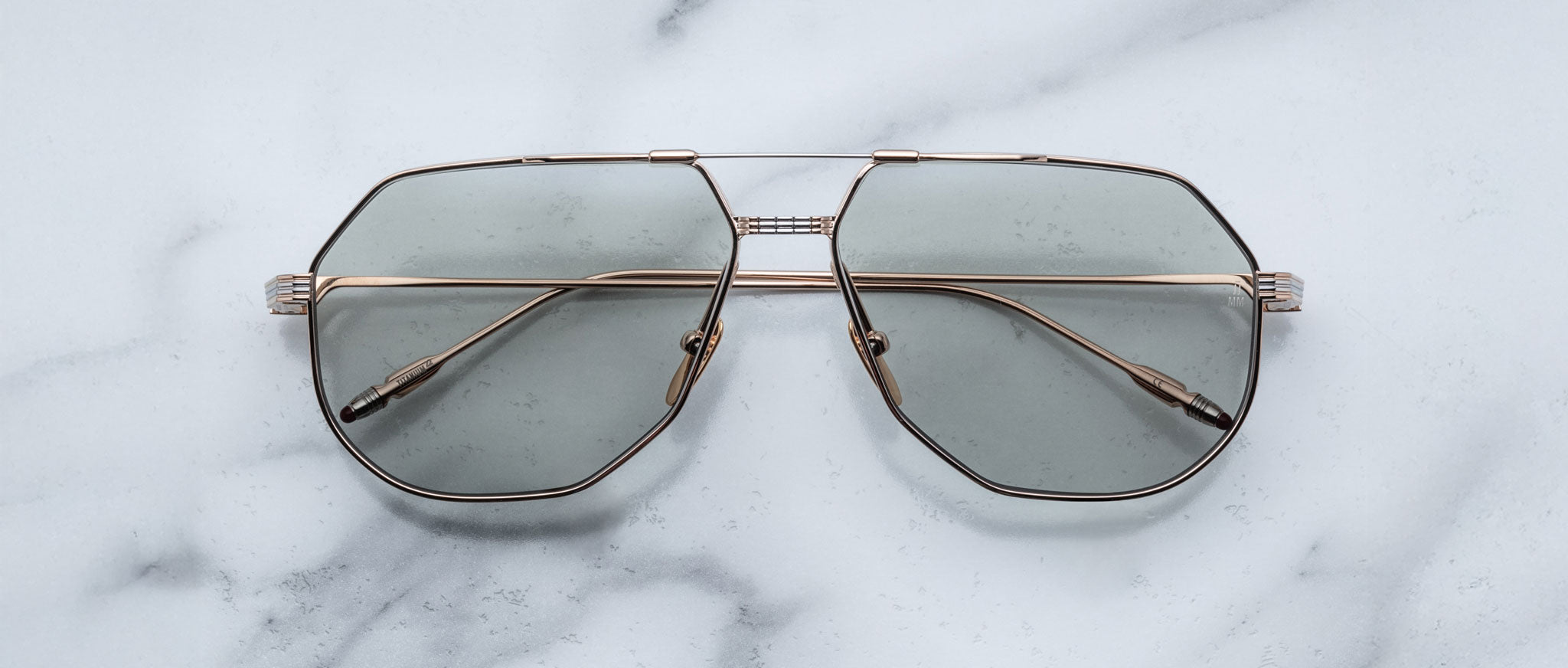 Jacques Marie Mage Reynold silver aviator sunglasses with green UV-protective lenses, front view.