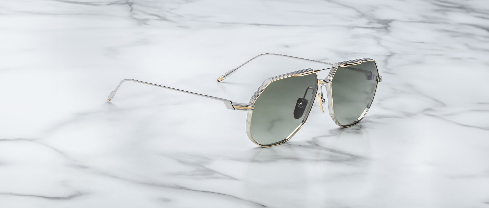 Jacques Marie Mage Reynold sunglasses, side view, featuring black frames and gold accents, by Jacques Marie Mage.