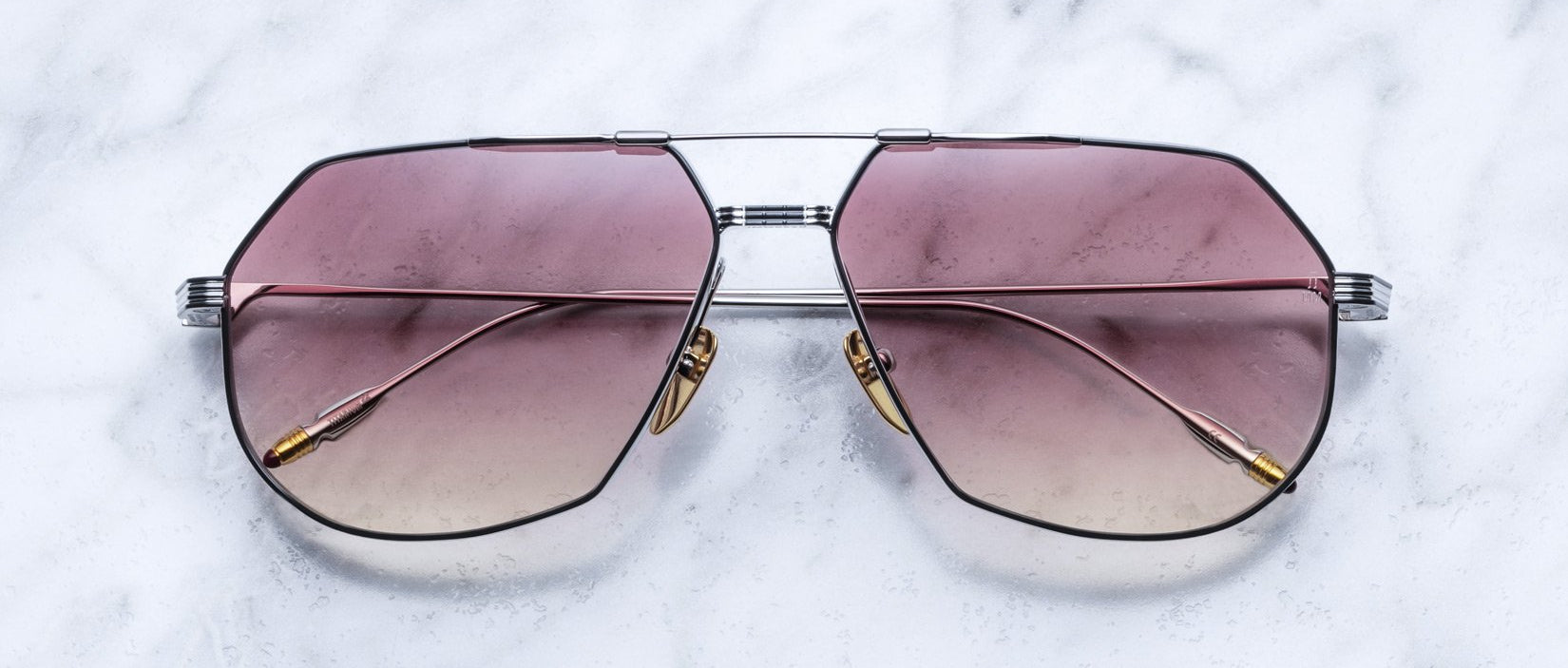 Jacques Marie Mage Reynold aviator sunglasses with pink gradient lenses and gold metal accents, front view.