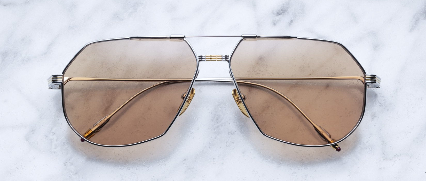 Jacques Marie Mage Reynold gold aviator sunglasses with brown lenses, front angle view.