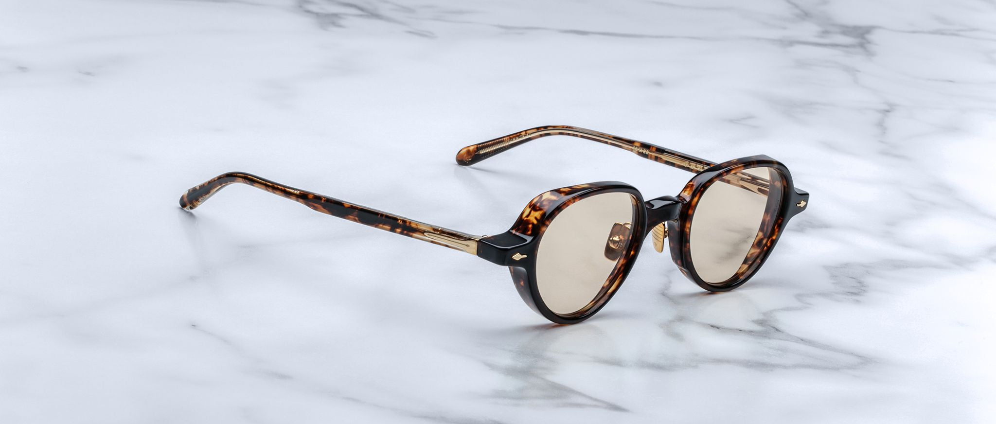Jacques Marie Mage The Clark round tortoiseshell sunglasses with light brown UV-protective lenses, front view.
