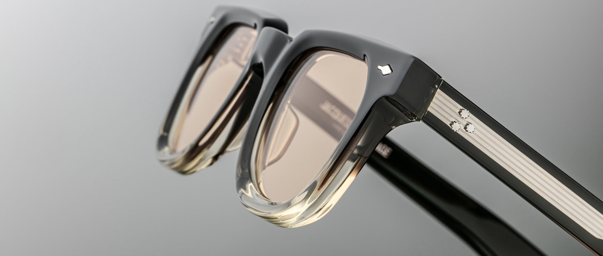 Jacques Marie Mage Vendome sunglasses, black gradient frame with light brown lenses, shown from above.