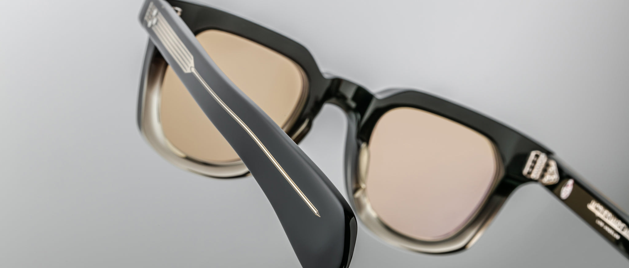 Close-up of Jacques Marie Mage Vendome sunglasses, black and beige frame, metal temple accents, frontal angle.
