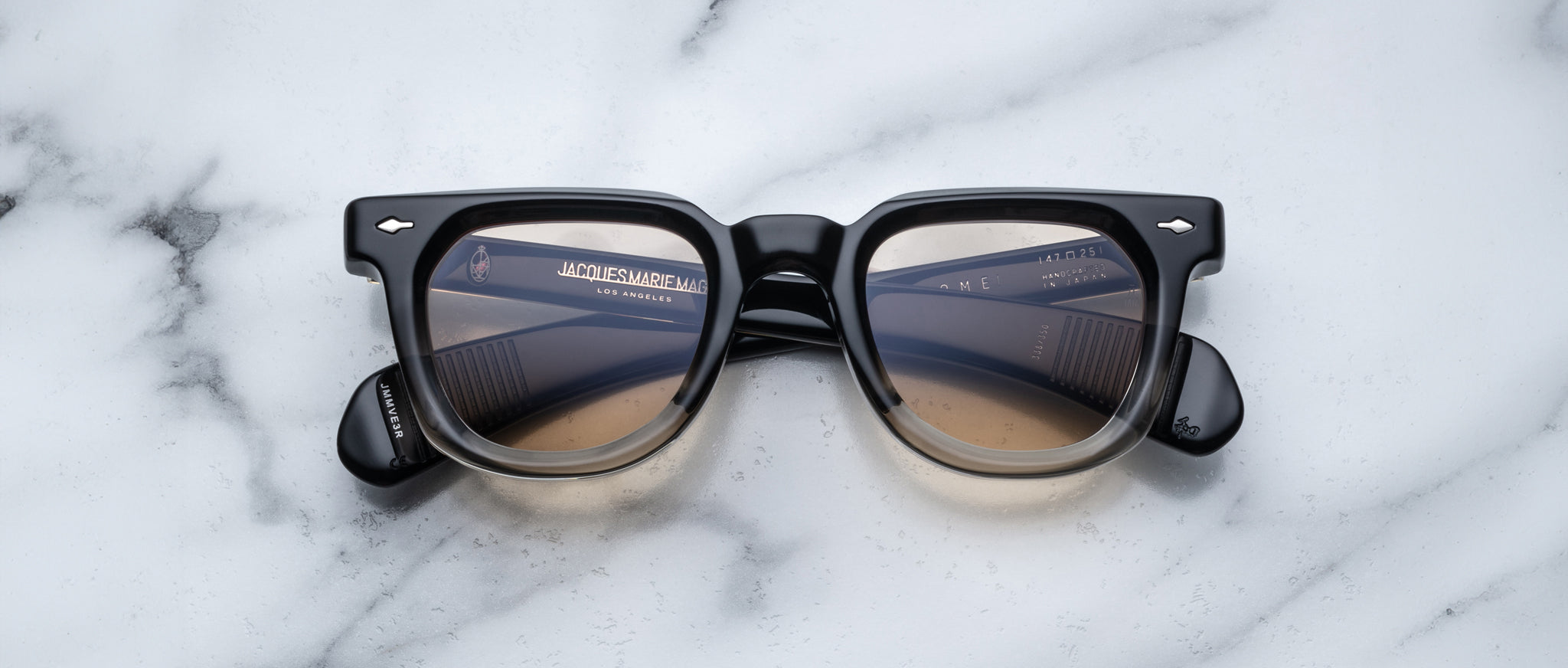 Jacques Marie Mage Vendome sunglasses, black frames and brown lenses, shown from the front.