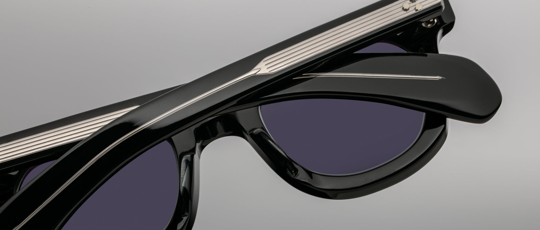 Jacques Marie Mage Vendome black sunglasses, close-up view, featuring metal temple accents and folded arms.
