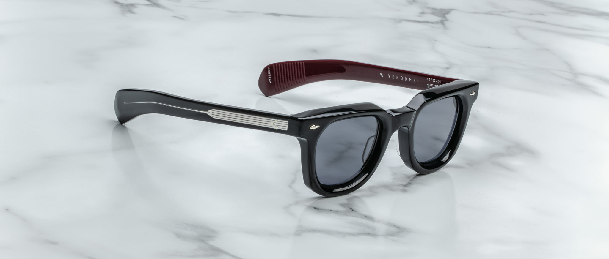 Jacques Marie Mage Vendome sunglasses, dark lenses, maroon arms, top view.