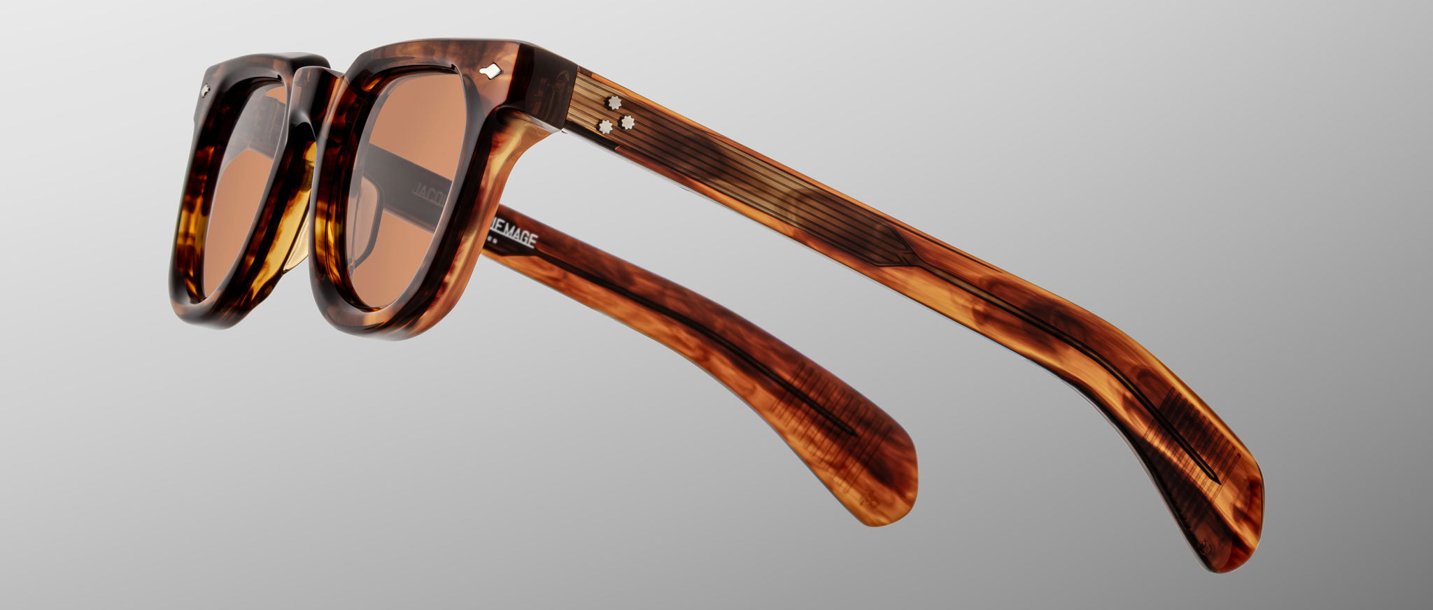 Jacques Marie Mage Vendome sunglasses with thick brown tortoiseshell frames and tinted lenses, front view.