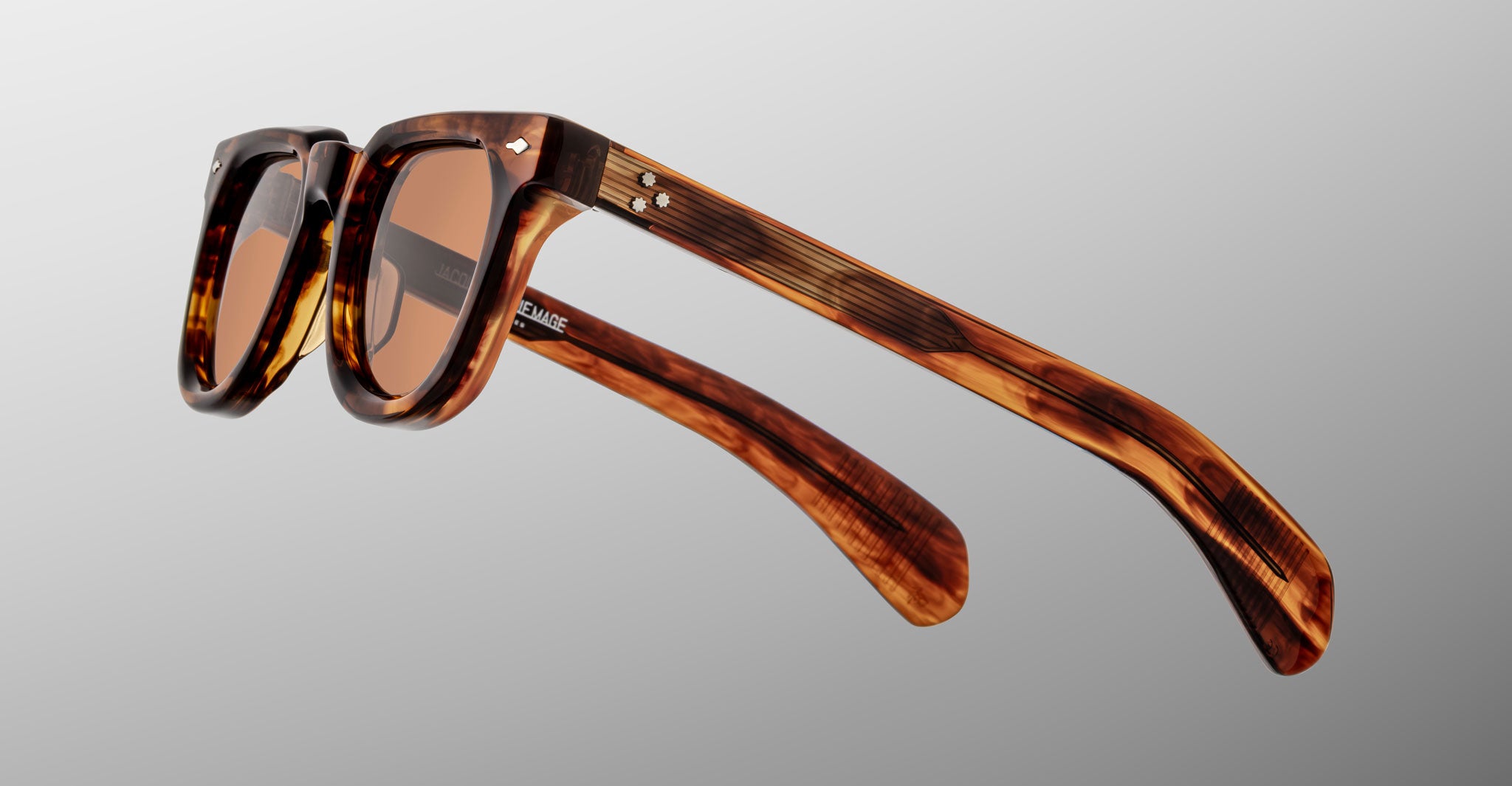 Jacques Marie Mage Vendome sunglasses by Jacques Marie Mage, featuring a tortoiseshell pattern and brown-tinted lenses, handcrafted in Japan, displayed on a light gray background.