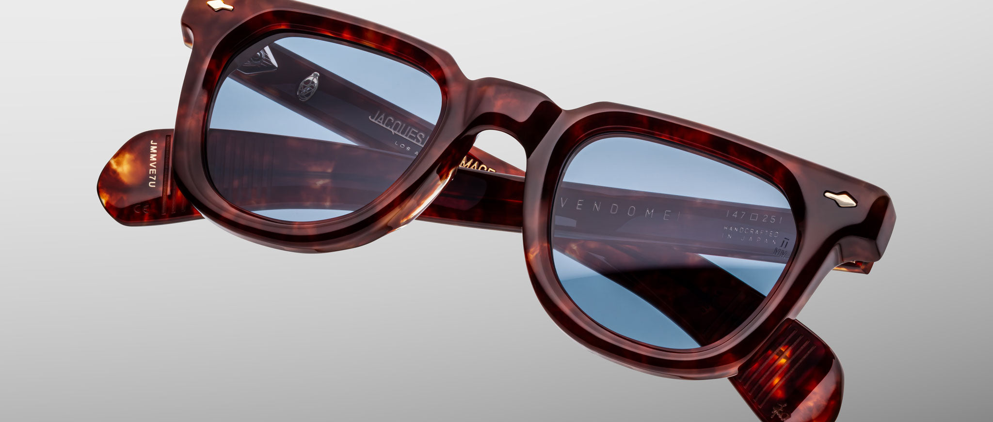 Jacques Marie Mage Vendome sunglasses, brown tortoiseshell frame with blue lenses, shown front view.
