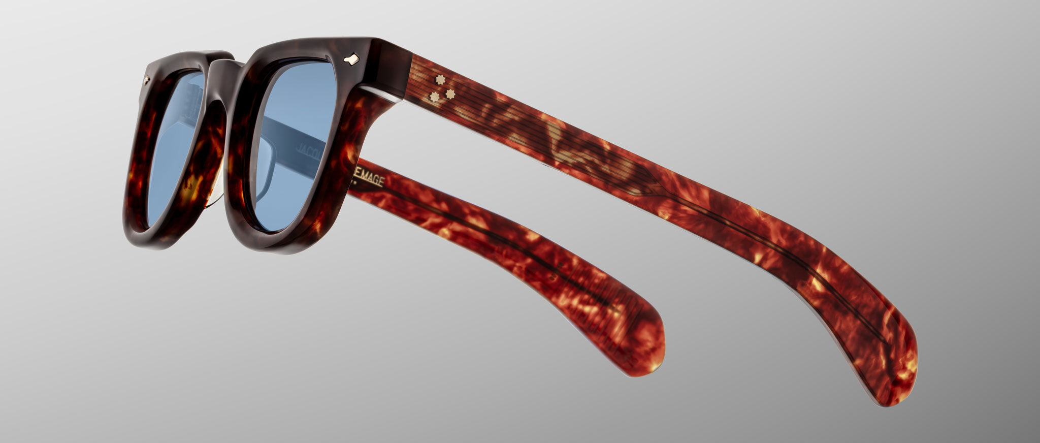 Jacques Marie Mage Vendome sunglasses, brown tortoiseshell frame with blue lenses, angled view.